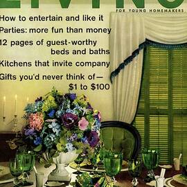 A Table Setting With A Floral Centerpiece by Luis Lemus