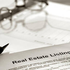 Real Estate Listing and Pen by Olivier Le Queinec