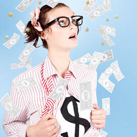 Successful Female Business Superhero Winning Money by Jorgo Photography
