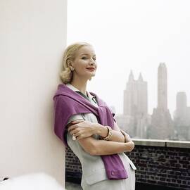 Sunny Harnett Leaning On Wall by Horst P. Horst