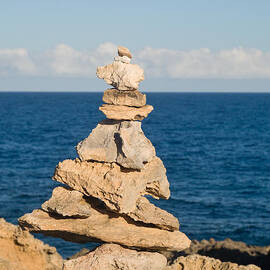Stack of rocks on coast of Kauai by Steven Heap