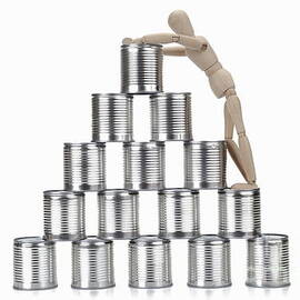 Wooden mannequin and tin cans by Sami Sarkis Photography