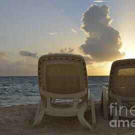 Sun lounger on tropical beach by Sami Sarkis Photography