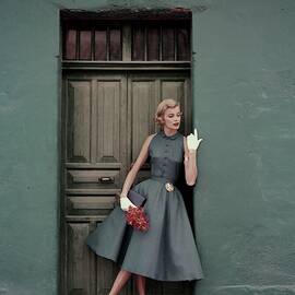 A 1950s Model Standing In A Doorway by Leombruno-Bodi