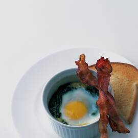 A Baked Egg With Spinach by Romulo Yanes