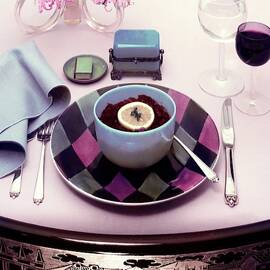 A Bowl Of Food On A Pink Table by Haanel Cassidy
