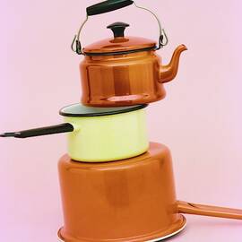 A Brass Teapot Stocked On Top Of Pots by Richard Rutledge