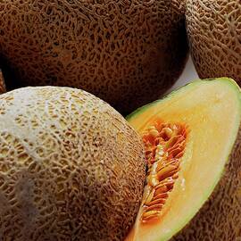A Cantaloupe Sliced In Half by Romulo Yanes