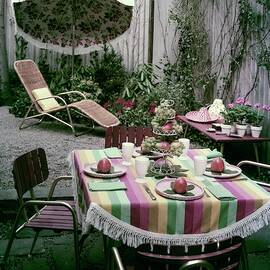 A Garden Set Up For Lunch by Tom Leonard