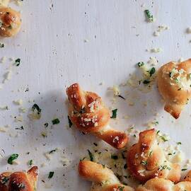 A Group Of Garlic Knots by Romulo Yanes