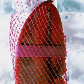 A Lobster Claw In Red Packaging by Romulo Yanes