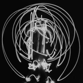 A Long Exposure Photograph Of A Man Dressing by Herbert Matter