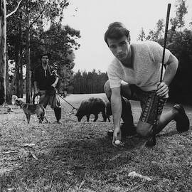 A Male Model Posing At A Golf Course by Leonard Nones
