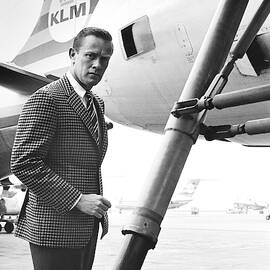 A Male Model Stands Next To A Klm Dc-9 Jet by Richard Waite