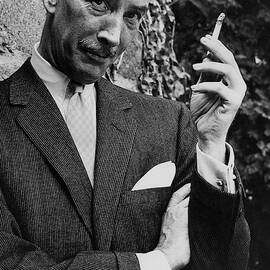 A Male Model Wearing A Cashmere Suit By Baker by Emme Gene Hall