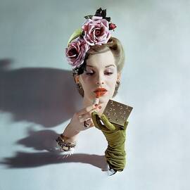 A Model Applying Lipstick by John Rawlings