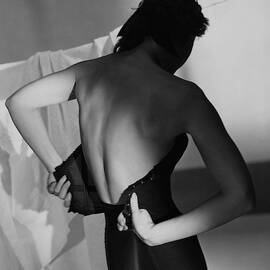 A Model Fastening Her Brassiere by Horst P. Horst