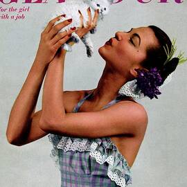 A Model Holding A Kitten by Gjon Mili