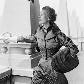 A Model Standing Against A Rooftop Column by Richard Rutledge