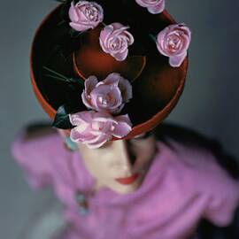 A Model Wearing A Bonwit Teller Hat by John Rawlings