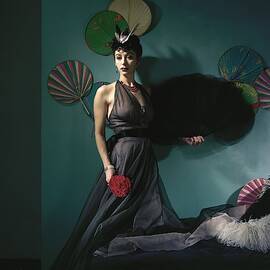 A Model Wearing A Dress With Fans by Horst P. Horst