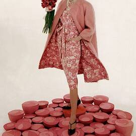 A Model Wearing A Matching Pink Outfit Holding by William Bell