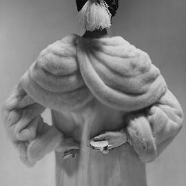 A Model Wearing A Mink Coat by Erwin Blumenfeld
