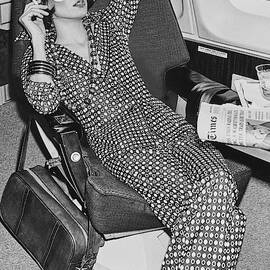 A Model Wearing A Sleeping Mask Smoking On An by Chris von Wangenheim