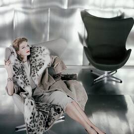 A Model Wearing A Snow Leopard Coat by Henry Clarke