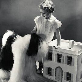 A Portrait Of A Young Girl And A Dog by Horst P. Horst
