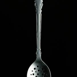 A Slotted Spoon by Romulo Yanes