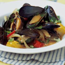 A Thai Dish Of Mussels And Papaya by Romulo Yanes