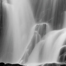 A Waterfall Flowing Down A Cliff Face by Mint Images - Art Wolfe