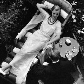 A Woman In A Chiffon Tea Gown In A Chaise Longue by The 3