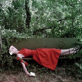 A Woman Lying On A Bench by John Rawlings