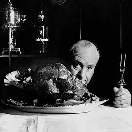 Alfred Hitchcock Looking At The Camera by John Rawlings