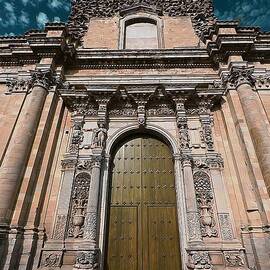 Ancient wood church door with iron hinges by Stefano Senise