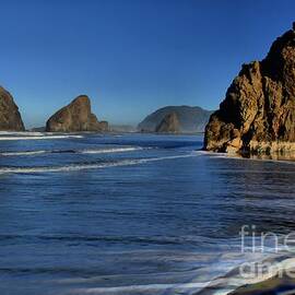 Bandon Sea Stacks In The Surf by Adam Jewell