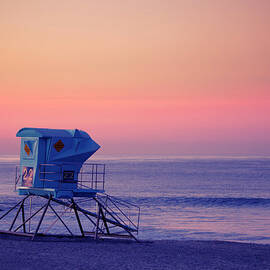 Beach Lifeguard Station At Sunset by Skodonnell