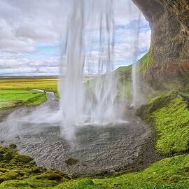 Behind Seljalandsfoss Waterfall by Kirk Lougheed