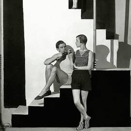 Bettina Jones Posing With A Male Model by George Hoyningen-Huene