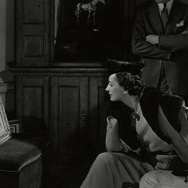 Betty Mclauchlen Looking At An Illustration by Edward Steichen