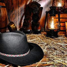 Black Cowboy Hat in an Old Barn by Olivier Le Queinec