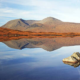 Black mount mountain range reflection by Grant Glendinning
