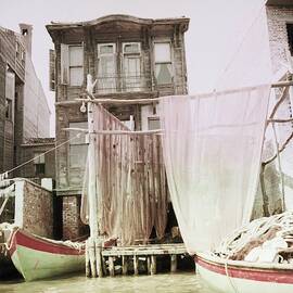 Boats Moored By A House In Turkey by Horst P. Horst