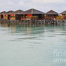 Bungalow resort on lagoon by Sami Sarkis Photography