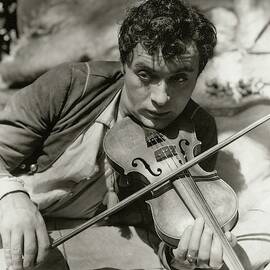 Charles Boyer Playing A Violin by George Hoyningen-Huene