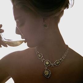 Close Up Of A Young Woman Wearing Jewelry by Bert Stern