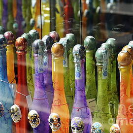 Colorful bottles of limoncello by Sami Sarkis Photography