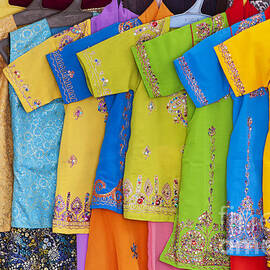 Colourful girls dresses in India by Tim Gainey